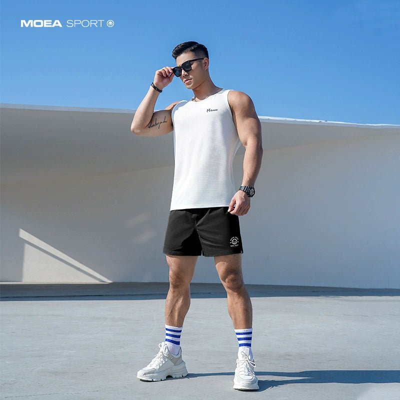 Quick-drying shorts men&#039;s street brand explosions loose casual beach running training fitness pants in summer.